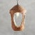 A 1950s glazed ceramic pendant light with oval cutout details on the sides and base. This fixture has gold detailing and a...