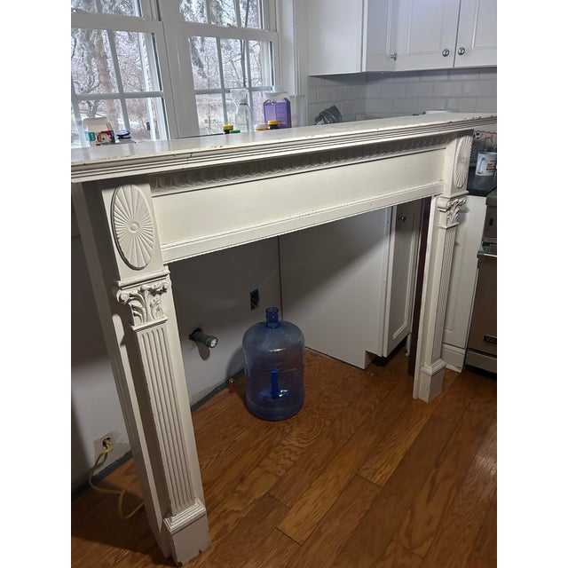 Architecturally Salvaged Wood Fireplace Mantel and Surrounding Woodwork in the Colonial Federal Neo Classical Style....