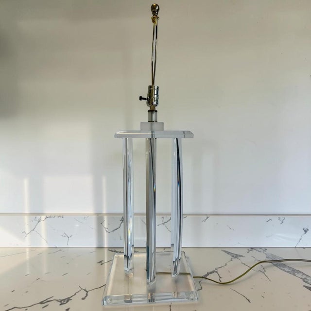 Van Teal style lucite table lamp. This piece has 4 boomerang style pieces connecting the top and bottom bases. Very thick,...