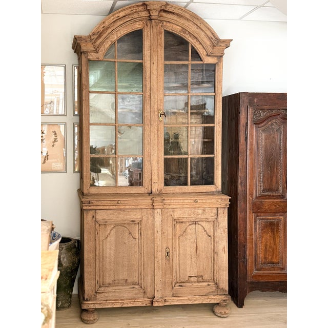 This incredibly striking and large early 19th century Dutch oak cabinet is a beautifully proportioned architectural piece,...