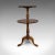 This is an antique whatnot stand. An English, mahogany two-tier afternoon tea table, dating to the Victorian period, circa...
