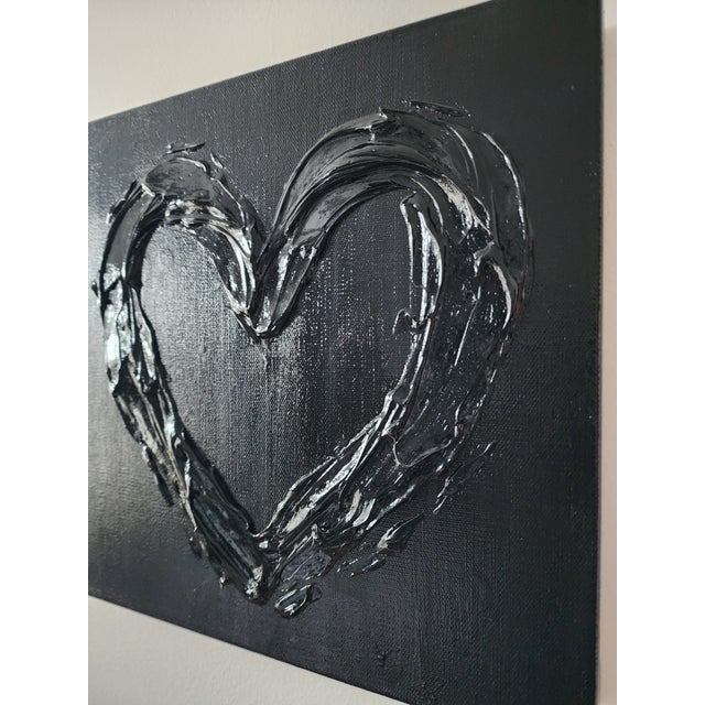 Glossy black heart measuring 12"X12" *Please note: colors may vary per screen.
