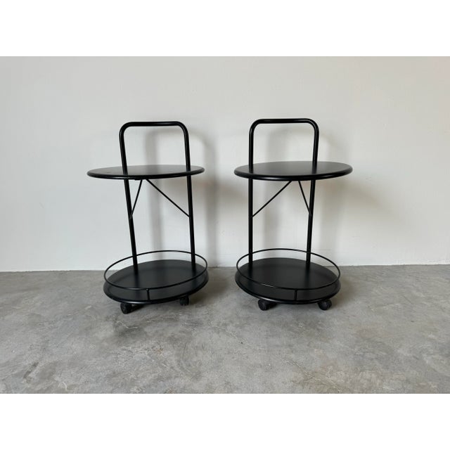 I'm pleased to offer for sale this stunning pair of vintage Italian Postmodern two- tier rolling round side tables by...