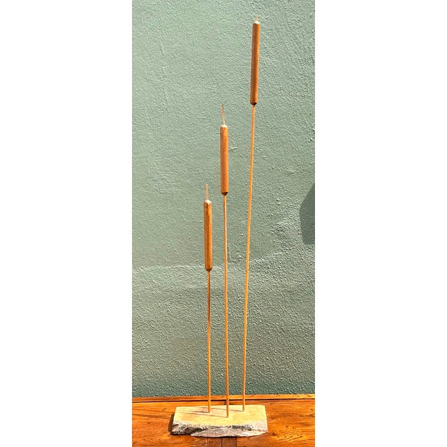 This striking hand-carved wood sculpture captures the serene essence of nature through an Organic Modern lens. Featuring...