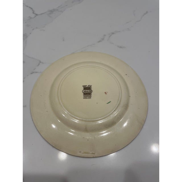 A charming vintage earthenware decorative plate by the historic pottery maker Adams of England, dating from the mid-20th...