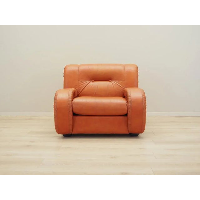 The armchair was made in the 1970s, Danish production. The legs are made of solid wood. The armchair has been preserved in...