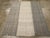 This Mid-20th century Turkish Flatweave Kilim rug, presents a bold yet understated design composed of three vertical...