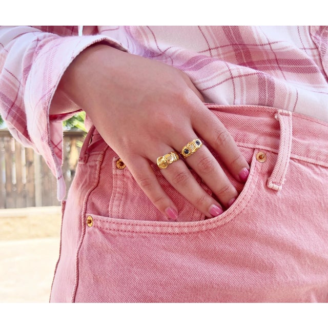 About This Ring: This exquisite Victorian buckle ring features a sparkling old mine cut diamond set in rich 18K gold....