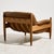 Danish lounge chair with exciting shapes and comfortable leather upholstery and a solid oak frame from the 1960s. with...