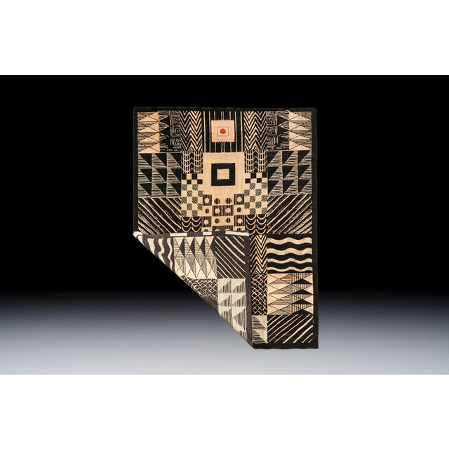 Hand-knotted in wool, this 10x14 vintage rug, dating to circa 1950–2000, draws inspiration from the pioneering Bauhaus...