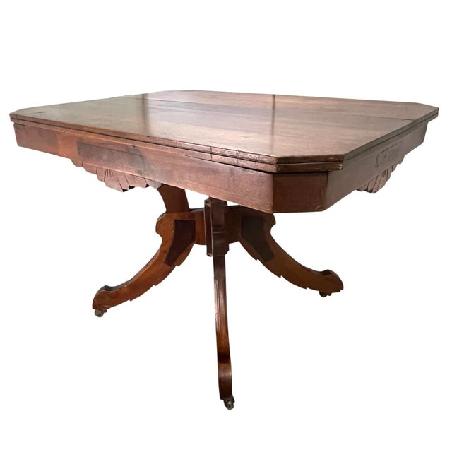 A beautiful late American 19th century walnut side table from the Victorian period. This antique table is stable with a...