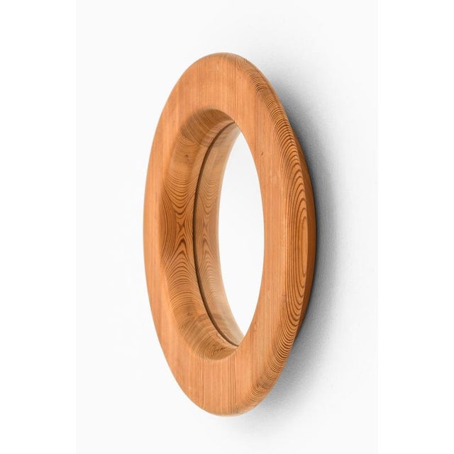 This mirror, designed by erik höglund and produced in sweden during the 1950s, exemplifies scandinavian modernism through...