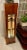 Art Deco Lighted Mahogany and French Rod Iron Pedestal Column. Front Panel and Top are Frosted Glass.