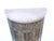 This gray marble top demi-lune metal cabinet has detailed metal work over old velvet background.