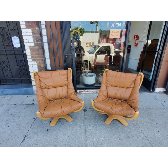 Amazing vintage pair of Danish modern, leather and birch chairs. The chairs are in amazing condition, made by Skippers...