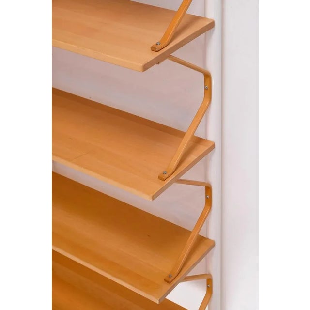 Lacquered steel, birch and beech wood. Measures: height 250 cm Depth 34 cm. Width 145.5 cm. This piece is attributed to...