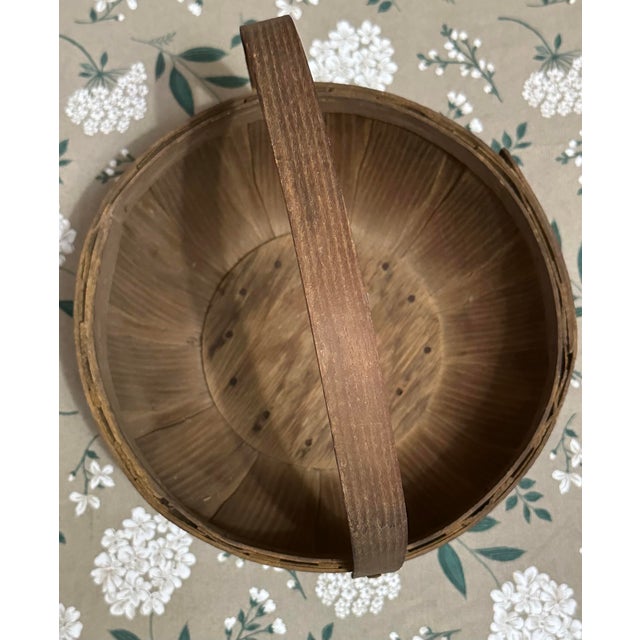 Vintage round storage basket made out of wood. The natural finish is perfect for rustic farmhouse or primitive decor. The...