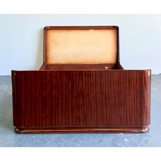 The Ralph Lauren "Metropolis" collection is celebrated for its sleek, urban sophistication, and this queen sleigh bed is a...