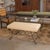 Iron bench with beautiful curved and looped base with matte black painted finish. Rectangular cushioned seat upholstered...