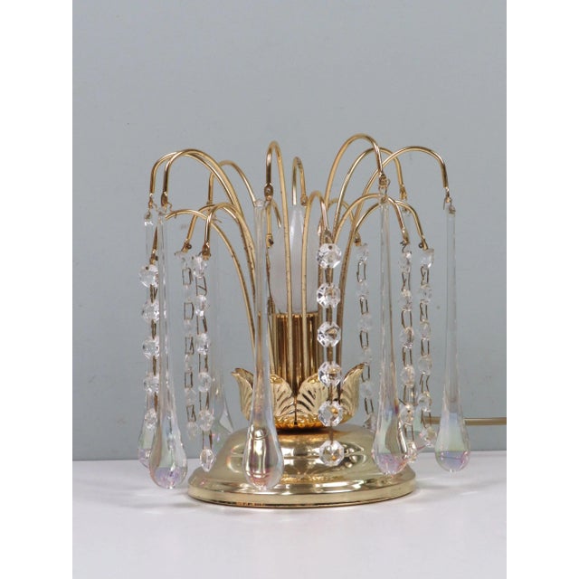 A fine example of Belgian mid-century craftsmanship, this 1970s Massive Belgium table lamp features a brass base adorned...