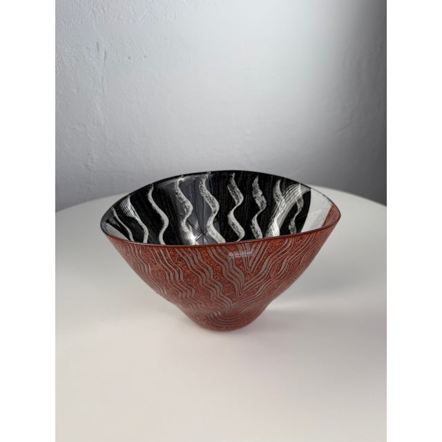 Striking decorative art glass bowl by Kosta Boda, featuring a bold, sculptural form and an expressive combination of red,...