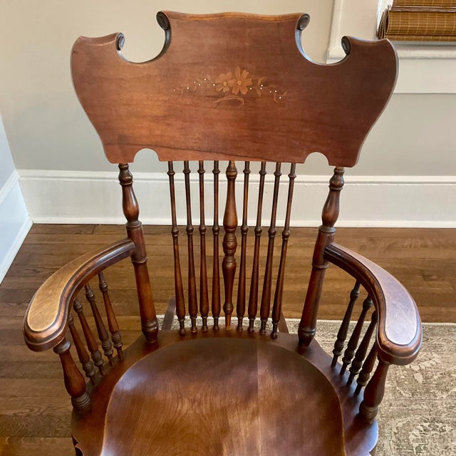 This antique rocker has been in my family forever. It’s a gorgeous piece of furniture with inlaid wood and mother-of-...