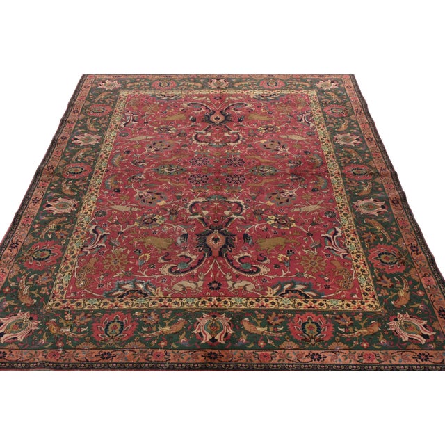 Finely woven in wool, an unusual antique 7x9 Agra rug originating from India circa 1900-1920. Carrying Persian...