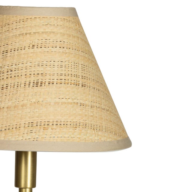 The Polly Buffet Table Lamp showcases sophistication with its single scalloped shade, casting a warm and inviting glow...