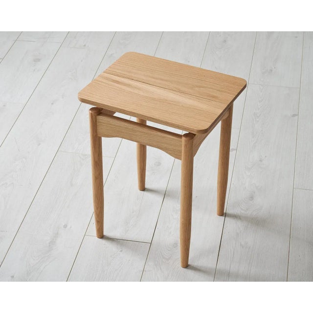The Hideout&nbsp;stool features elegant floating rails and a slender shadow gap running centrally along seat with sublte...