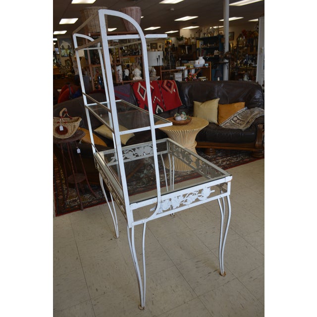 This iron & metal stand appears to be vintage. Many uses! I cannot find another like it to compare. I thought it came...