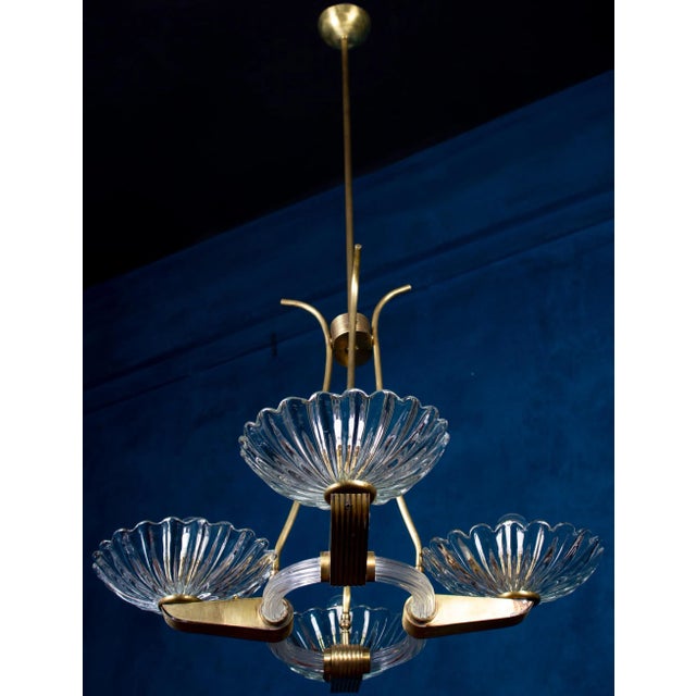Amazing 4 -shade murano glass chandelier with elegant shaped brass mount, by barovier. Excellent vintage condition. Four e...