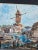 This is an oil painting of Montmartre, Paris, featuring the Moulin de la Galette, a historic windmill. This is presented...