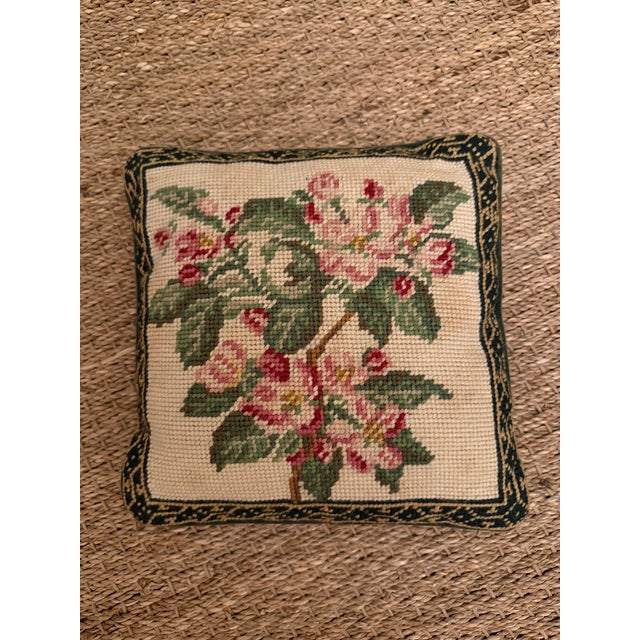 Charming vintage needlepoint pillow featuring a beautifully worked flowering branch in soft pinks, rose and layered greens...