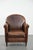 Beautiful vintage sheepskin armchair with warm colors and a characterful appearance. : This characterful sheepskin...