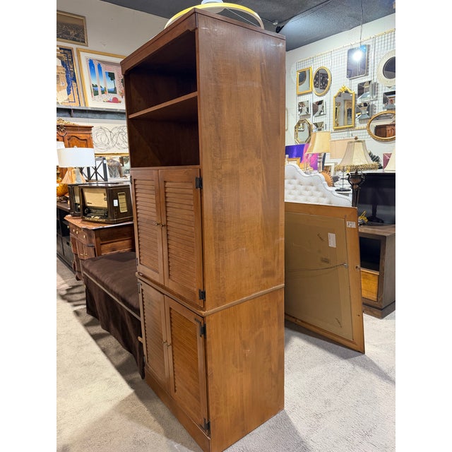 Blending timeless craftsmanship with versatile functionality, this Ethan Allen two-piece bookcase cabinet offers a refined...