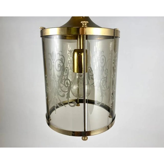 Beautiful Cylindrical Lantern Made Of Smoked Glass And Metal with Engraving. Vintage Lantern made of glass and metal...