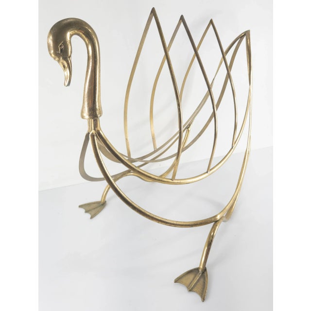 We are selling this great bronze or brass magazine rack. This rack has the head of a swan or goose and three uprights for...