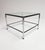 Chrome coffee table with tempered glass (see hallmark on table, 10 mm). The tabletop is held in place by the knobs on the...