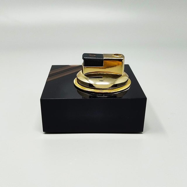 1970s stunning hollywood regency smoking set with table lighter, ashtray and box in lucite and brass. The table lighter...