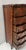 Transitional-style chest of drawers in wood veneer Front features a central recess and side panels with flat edges Six...