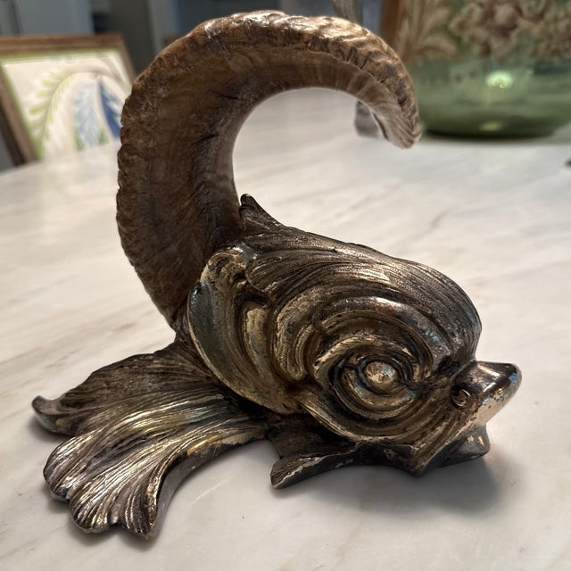 By the Legendary ITALIAN ARTIST-designer. Modeled as a mythical dolphin, hand-crafted from Sarda rams horn and silvered...