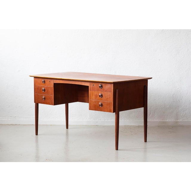 Mid-Century Modern Danish Teak Desk with Six Drawers, 1960s, in Good conditions. Designed 1960 to 1969