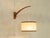 Beautiful wall lamp from the 1960s in scandinavian design. Swiveling teak frame with a beige lampshade and e27 socket....