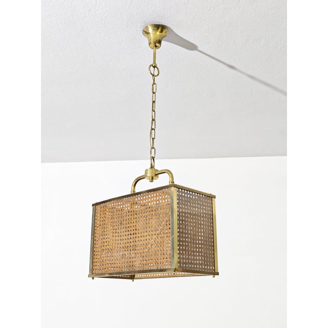 Brass, acrylic glass, and Vienna straw pendant lamp, 1970s Brass frame with two lights. Acrylic glass and cane shade....