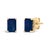 Immerse yourself in the timeless elegance of these stud earrings, each boasting a lustrous 6x4mm emerald-cut blue...