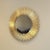 Make a bold statement with this dramatic round sunburst mirror. Measuring 30.25" in diameter and weighing approximately 30...