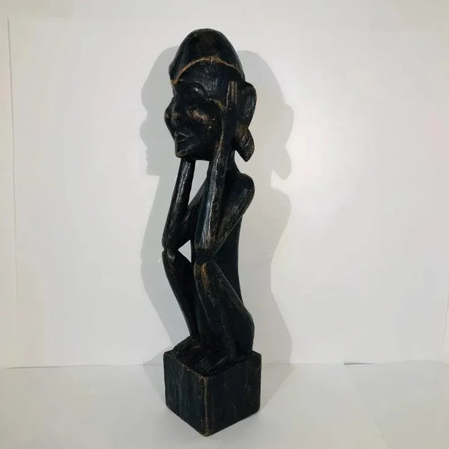 This beautiful piece of Tribal Art is a rare hand carved Senufo seated male statue from the Ivory Coast. Date: Early 1900s...