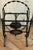 Early Wrought Iron Magazine Rack With a Heart Shaped Design and Painted Floral Medallion For Sale - Image 4 of 5