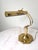 A vintage brass table lamp boasting a classically elgant design. Original wiring tested and in good working condition....