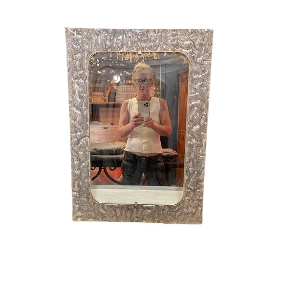 Original French Midcentury Lucite pair of mirrors. Beautiful wavy texture - filled with movement. There is a pair...